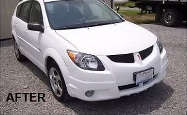 After: a white Pontiac Vibe repaired by Fenton's Custom & Collision