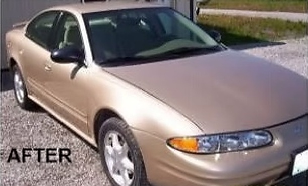 After: a gold Oldsmobile Alero sedan repaired by Fenton's Custom & Collision
